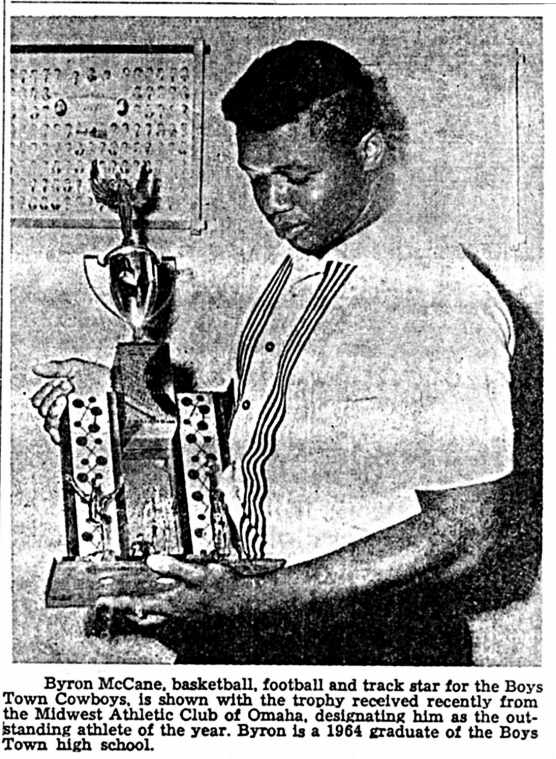 This is Byron McCane with a trophy from the Midwest Athletic Club in Omaha recognizing him as their Outstanding Athlete of the Year in 1964.