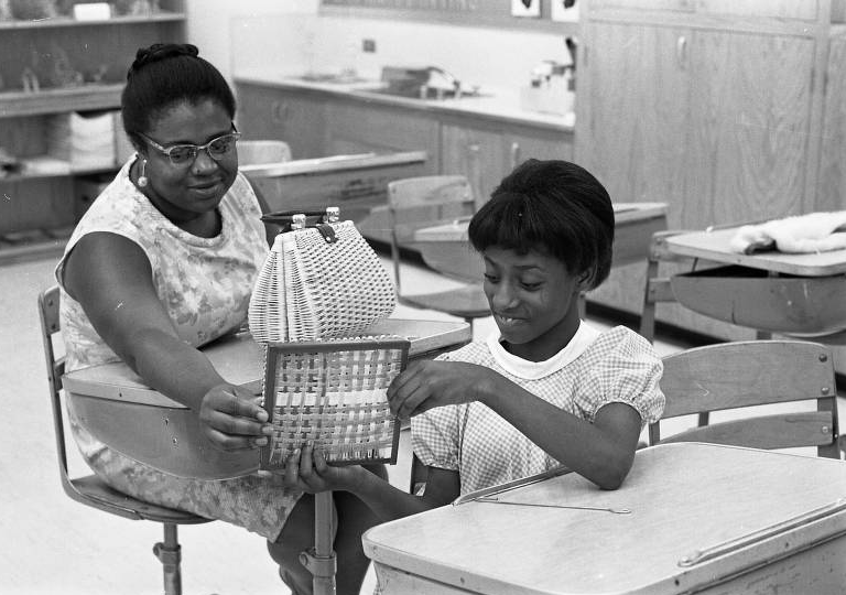 This is a 1968 pic of a mother and daughter at Saratoga School during a parent night program.